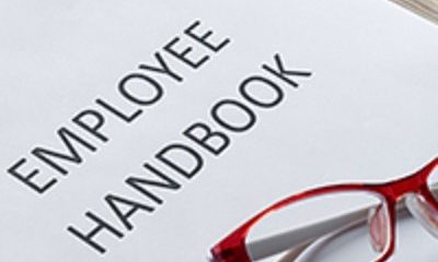 Employee Handbook with glasses
